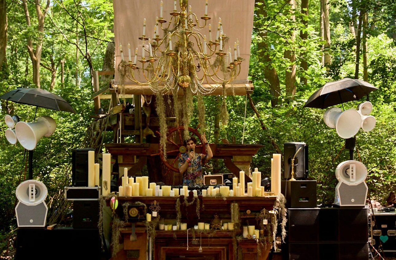 Void cabinets flanking a hand-built stage in daylight