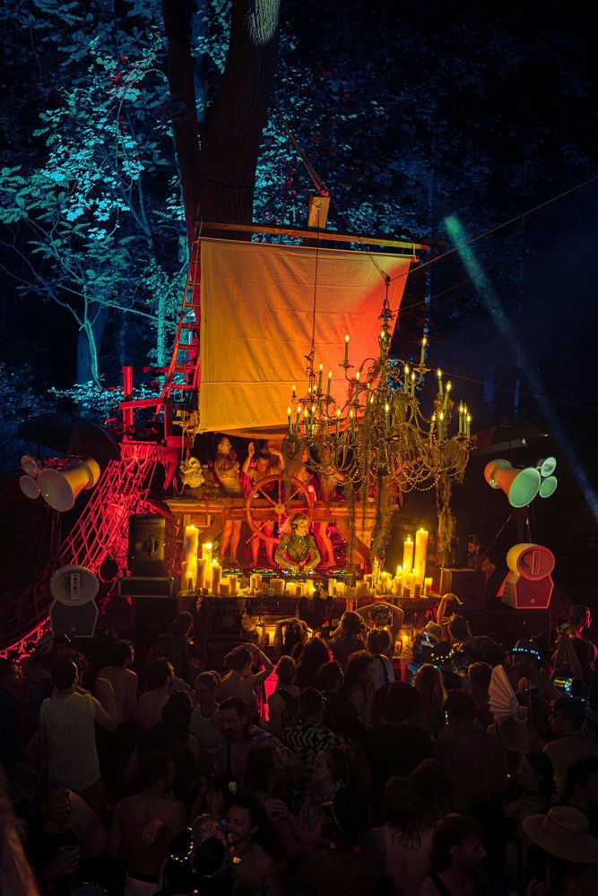 The ship stage and horns above a packed floor at CAMP