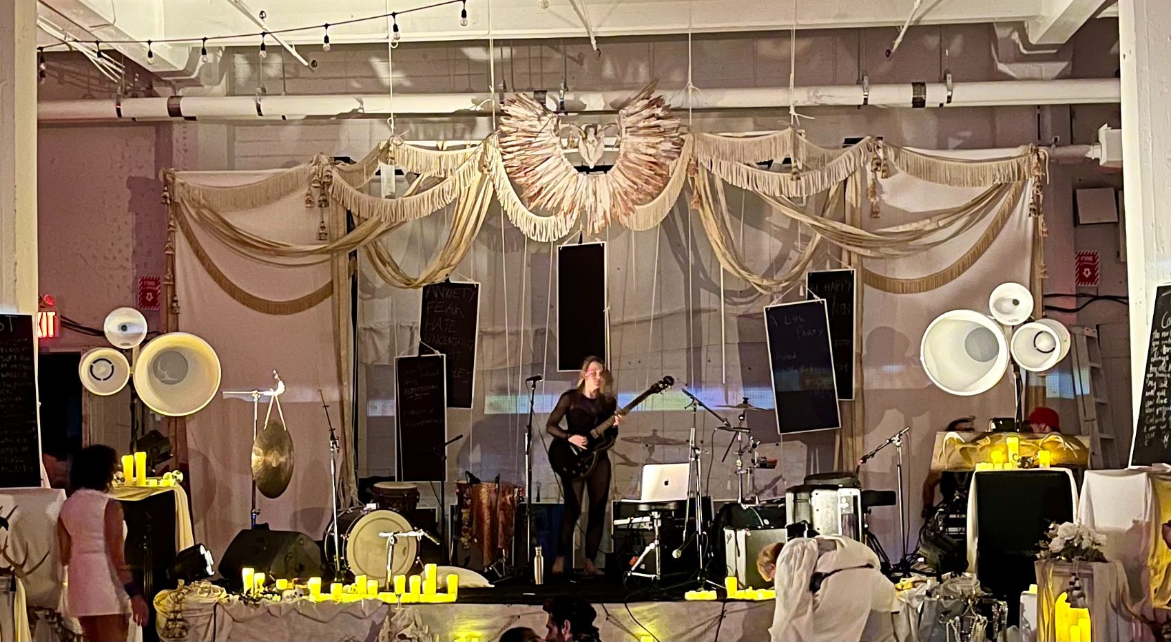 Void horns flanking the stage in daylight